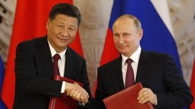 Руският президент Владимир Путин и китайският президент Си Дзинпин пристъпиха